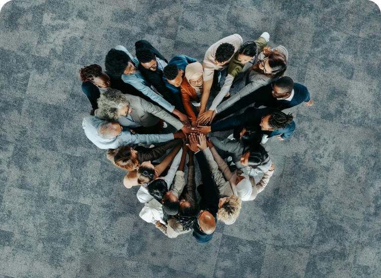 People uniting in teamwork gesture